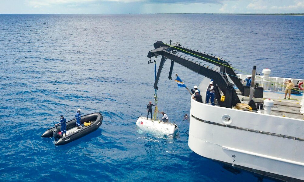 Triton Full Ocean Depth Submarine lifted by a Crane