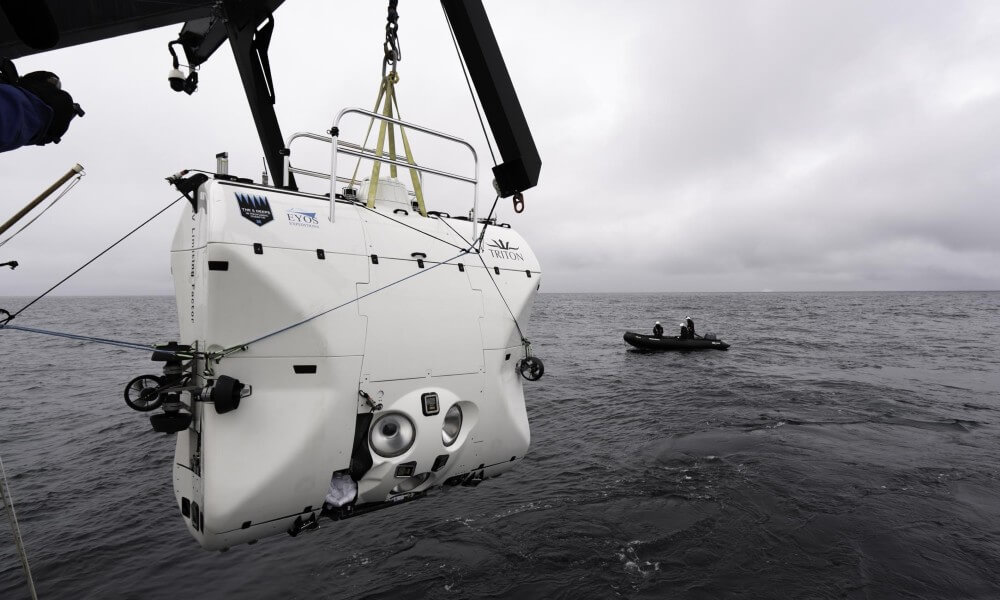 Triton Full Ocean Depth Submarine lifted by a Crane